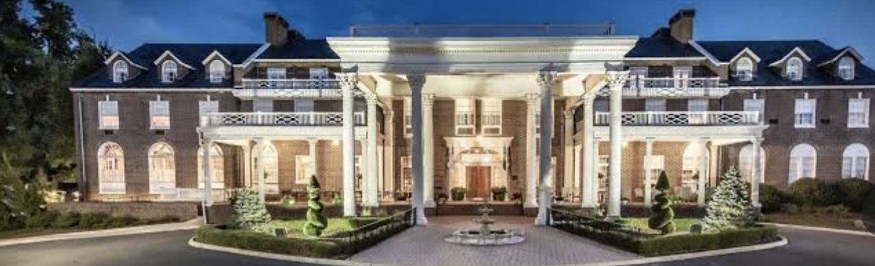 Wide view of The Mimslyn Inn facade at dusk